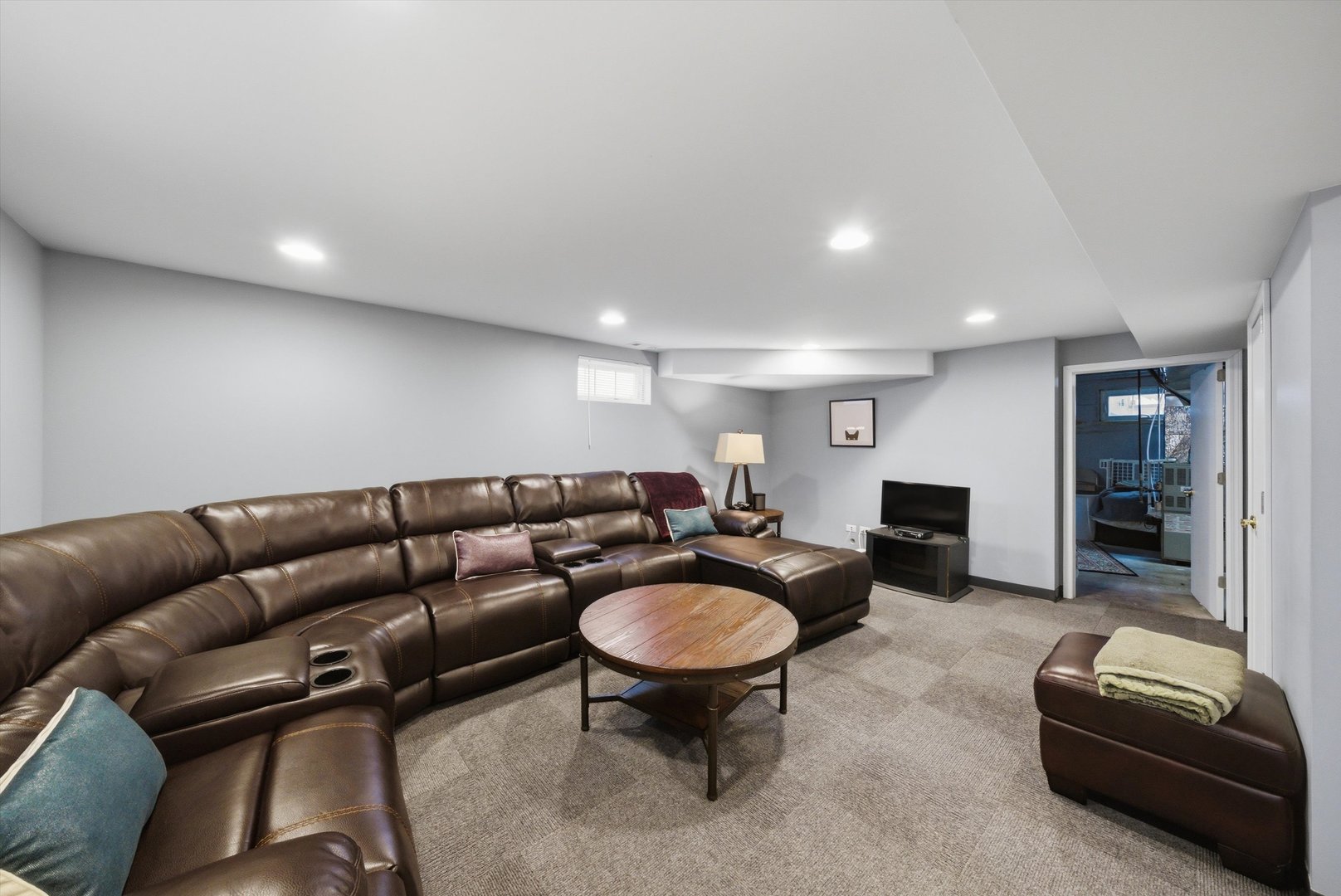 3719 211th Place Matteson, IL 60443 - Photo 26 of 48 a living room with furniture a glass table and kitchen view