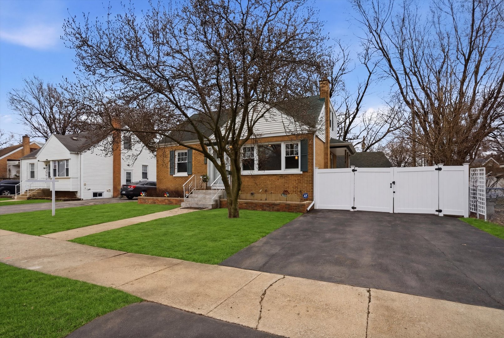 3719 211th Place Matteson, IL 60443 - Photo 35 of 48 a view of a white house with a big yard and large trees