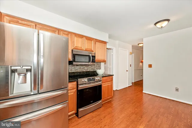 a kitchen with granite countertop a sink and a window