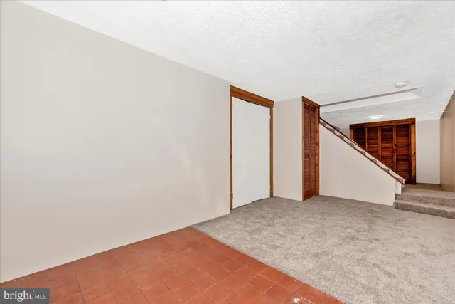 a view of a storage & utility room with a sink