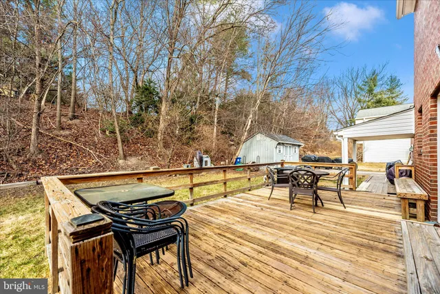 a view of house with outdoor space and seating area