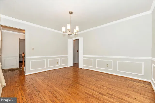 a kitchen with stainless steel appliances granite countertop a stove a sink dishwasher and a refrigerator