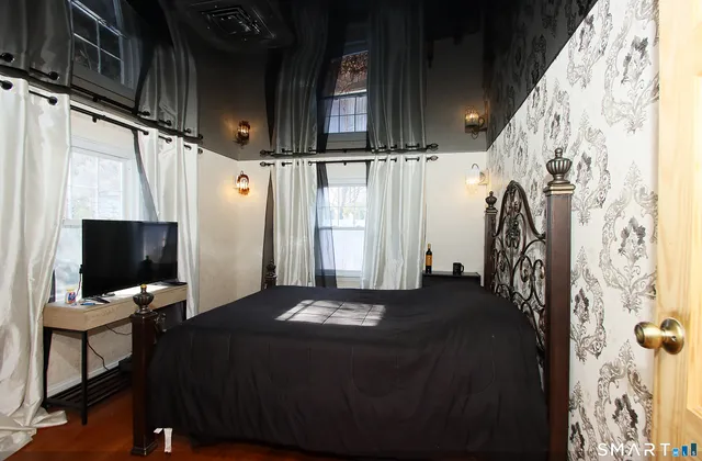 a view of a livingroom with furniture and staircase