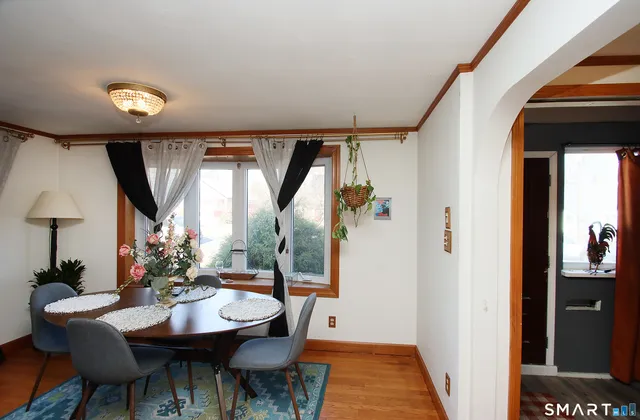 a view of a dining room with furniture and window