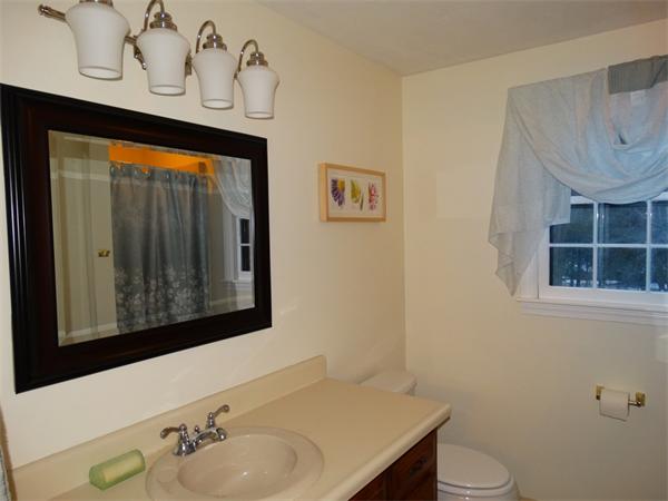 25 Fox Hill Road Ashland, MA 01721 - Photo 20 of 23 a bathroom with a sink and a mirror