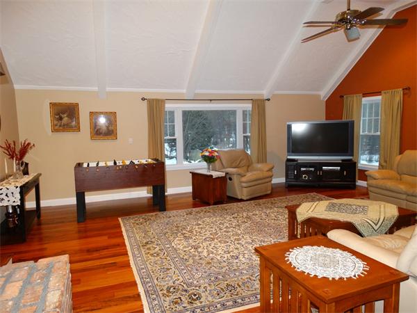25 Fox Hill Road Ashland, MA 01721 - Photo 8 of 23 a living room with furniture and a flat screen tv