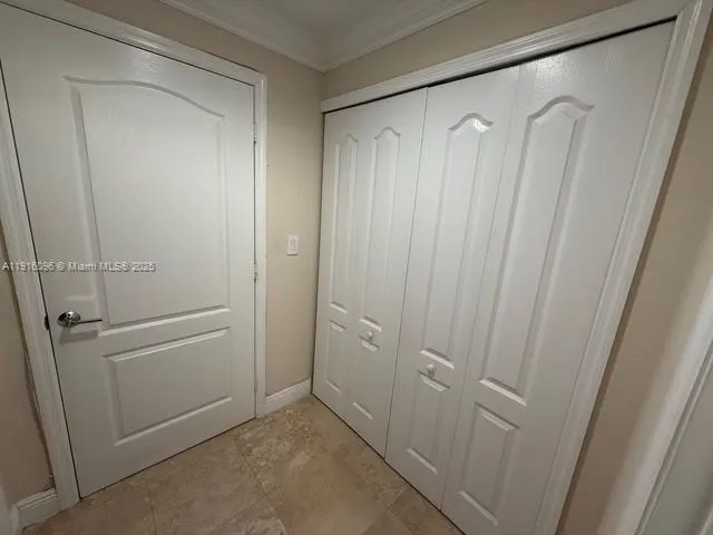 a bedroom with a bed and a mirror