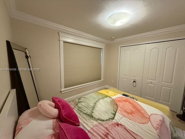 16420 Southwest 48th Terrace Miami, FL 33185 - Photo 25 of 59 a bedroom with a bed and a window