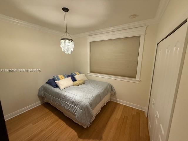 16420 Southwest 48th Terrace Miami, FL 33185 - Photo 28 of 59 a bedroom with a bed and a mirror