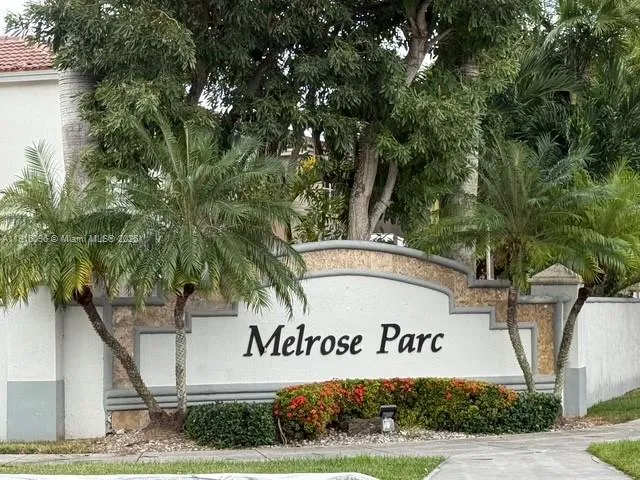a view of multiple houses with a street