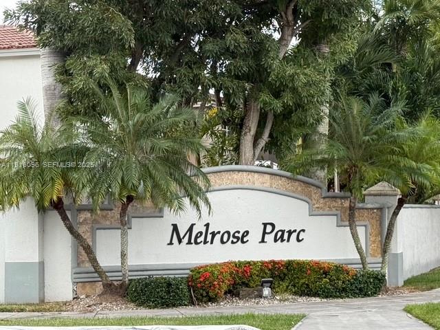 16420 Southwest 48th Terrace Miami, FL 33185 - Photo 4 of 59 a sign that is on a tree in front of it