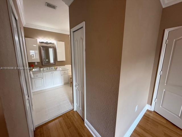 16420 Southwest 48th Terrace Miami, FL 33185 - Photo 45 of 58 a view of a hallway with wooden floor