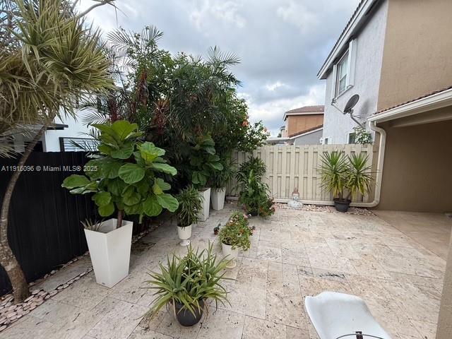 16420 Southwest 48th Terrace Miami, FL 33185 - Photo 49 of 58 a potted plant sitting in front of a building