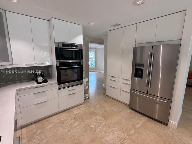 16420 Southwest 48th Terrace Miami, FL 33185 - Photo 7 of 59 a kitchen with stainless steel appliances a refrigerator sink and microwave