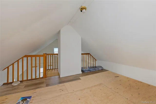a view of a hallway with stairs