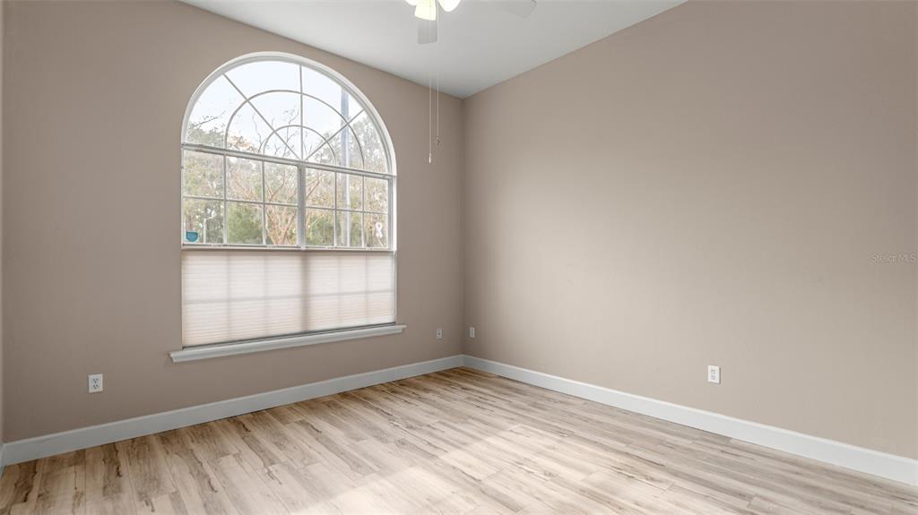 9428 Southwest 39 Avenue Gainesville, FL 32608 - Photo 21 of 43 an empty room with a window