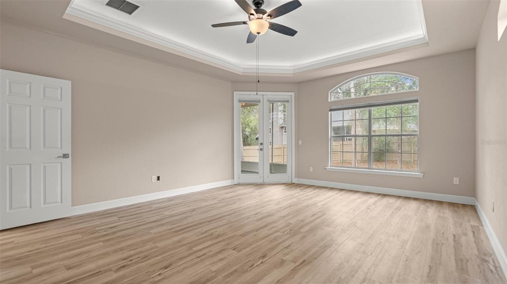 9428 Southwest 39 Avenue Gainesville, FL 32608 - Photo 27 of 43 wooden floor in an empty room with a window