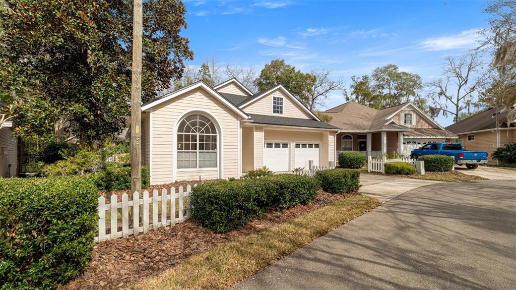 9428 Southwest 39 Avenue Gainesville, FL 32608 - Photo 3 of 43 a front view of a house with a garden