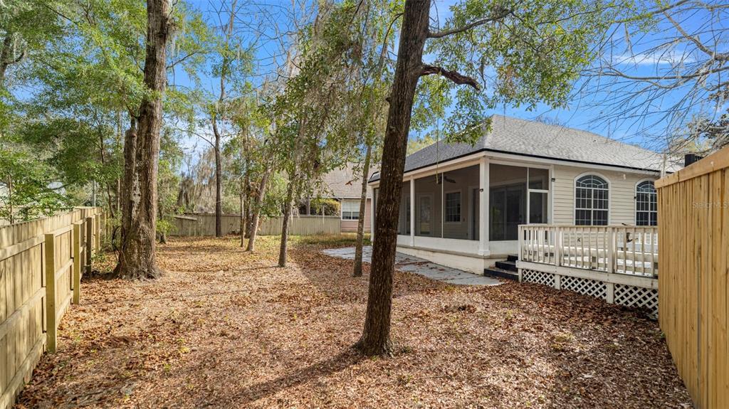 9428 Southwest 39 Avenue Gainesville, FL 32608 - Photo 41 of 43 a house with trees in front of it