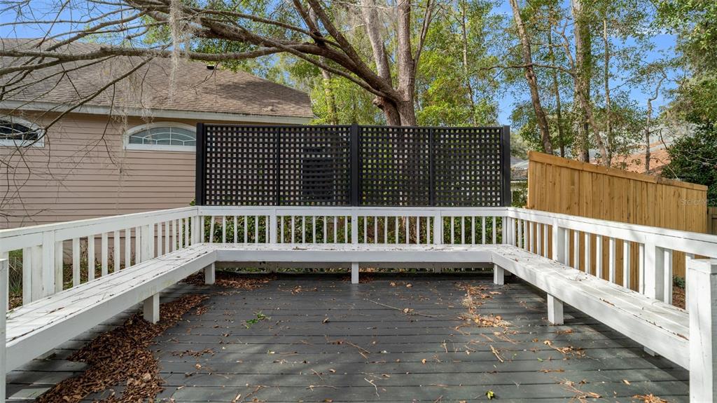9428 Southwest 39 Avenue Gainesville, FL 32608 - Photo 42 of 43 a view of a roof deck with wooden fence and wooden floor
