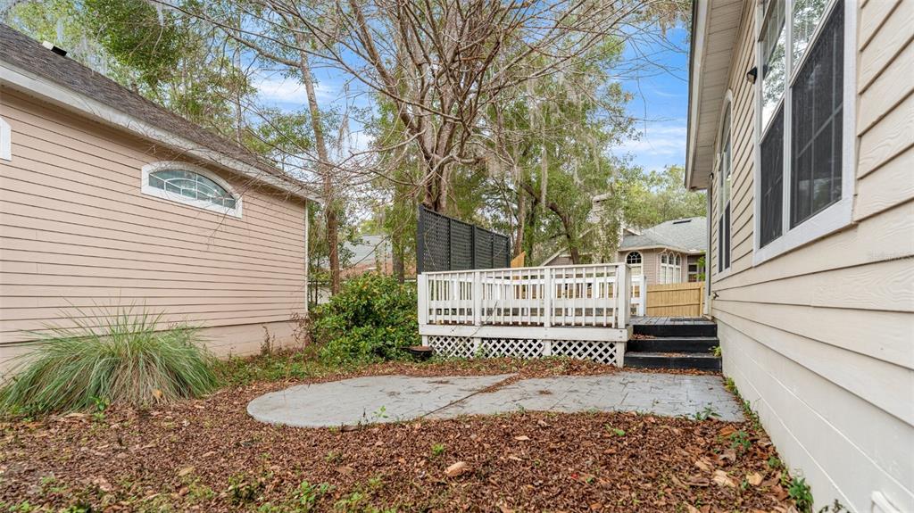 9428 Southwest 39 Avenue Gainesville, FL 32608 - Photo 43 of 43 a view of a house with a small yard and wooden fence