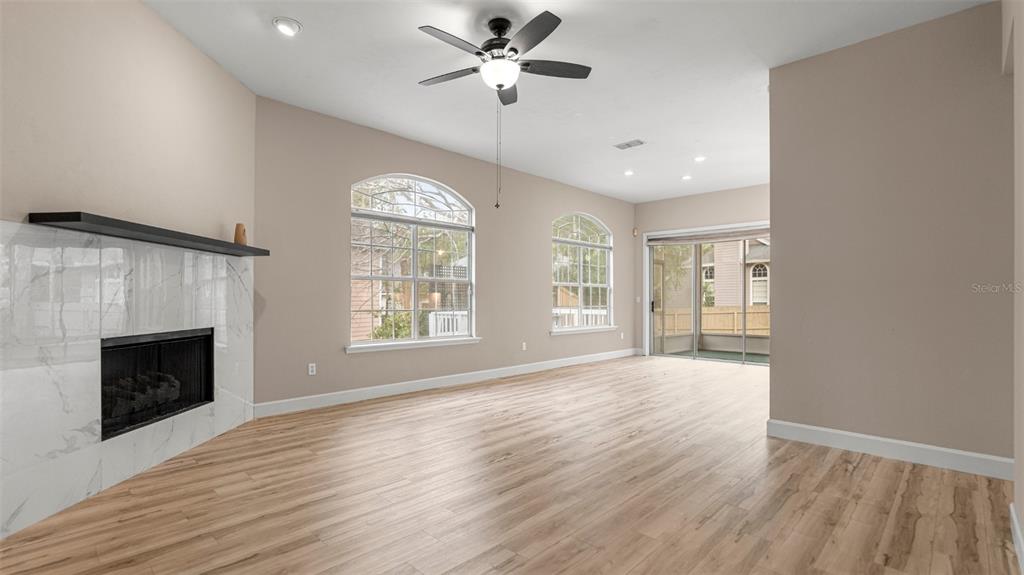 9428 Southwest 39 Avenue Gainesville, FL 32608 - Photo 9 of 43 a view of an empty room with a window and wooden floor