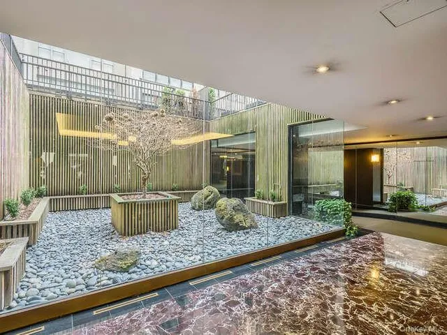 a view of a house with backyard and porch