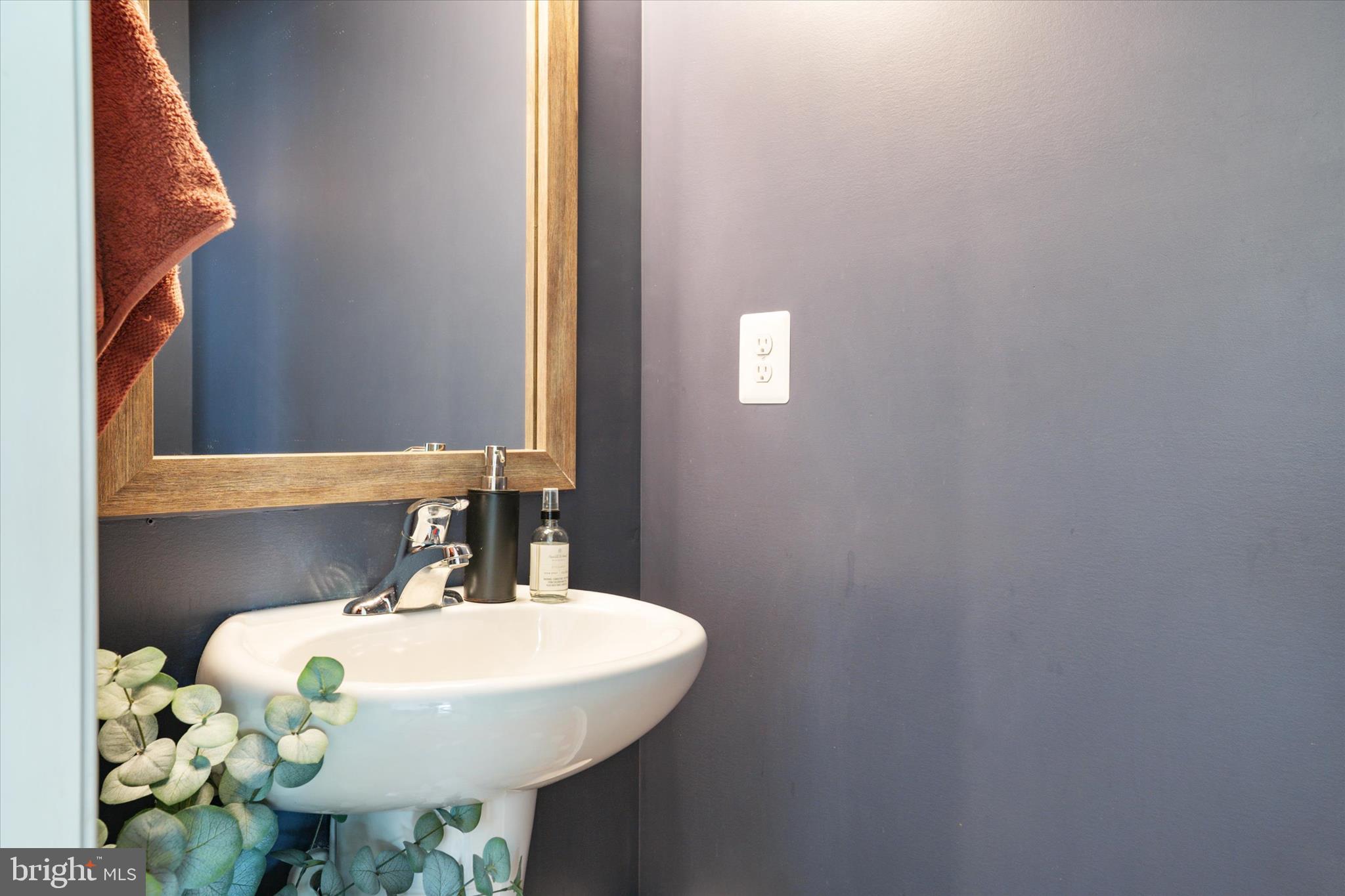 200 Newtown Road Chester, MD 21619 - Photo 19 of 50 a bathroom with a sink mirror and toilet