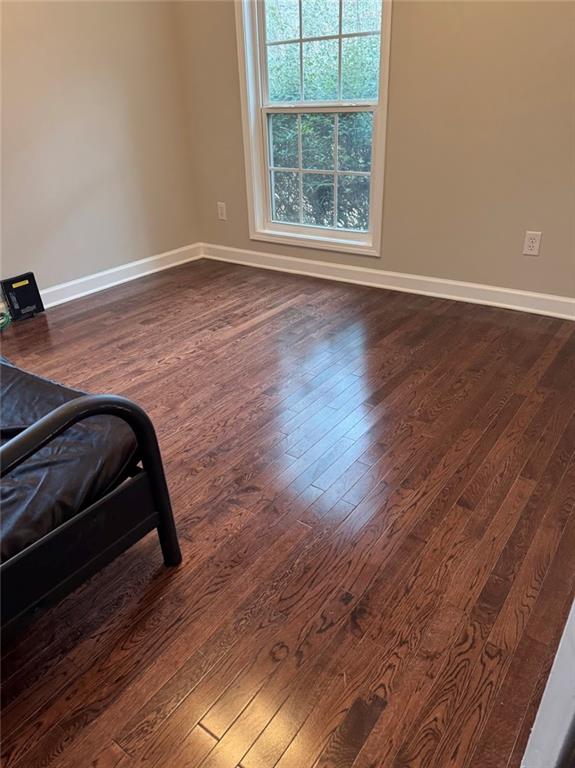 7025 Fletcher Drive Winston, GA 30187 - Photo 11 of 63 an empty room with wooden floor cabinet and windows