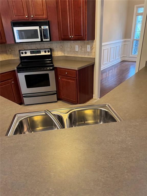 7025 Fletcher Drive Winston, GA 30187 - Photo 44 of 63 a kitchen with a sink and a microwave
