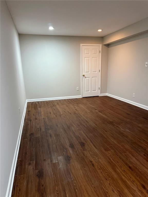 7025 Fletcher Drive Winston, GA 30187 - Photo 56 of 63 an empty room with wooden floor and windows