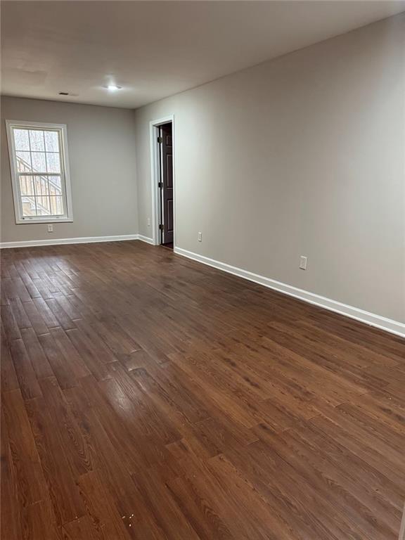 7025 Fletcher Drive Winston, GA 30187 - Photo 58 of 63 an empty room with wooden floor and windows