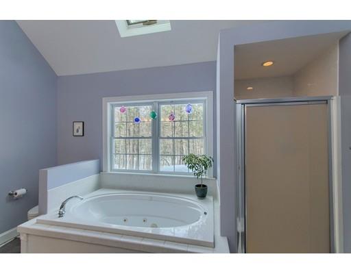 85 Chicopee Row Groton, MA 01450 - Photo 16 of 30 a bathroom with a tub sink and mirror