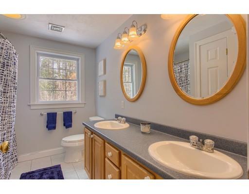 85 Chicopee Row Groton, MA 01450 - Photo 19 of 30 a bathroom with a toilet a sink and a mirror