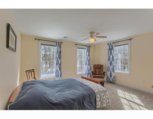 85 Chicopee Row Groton, MA 01450 - Photo 20 of 30 a bedroom with a large bed and a window