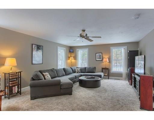 85 Chicopee Row Groton, MA 01450 - Photo 4 of 30 a living room with furniture and a flat screen tv