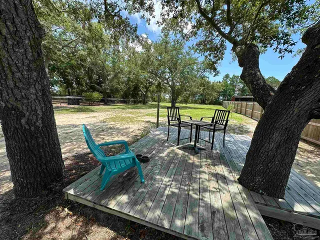 a view of a swimming pool with a patio