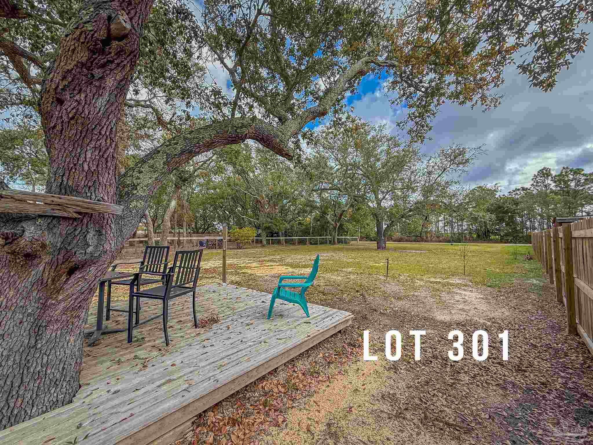 301 Katie Street Milton, FL 32583 - Photo 12 of 16 a view of a park with large trees