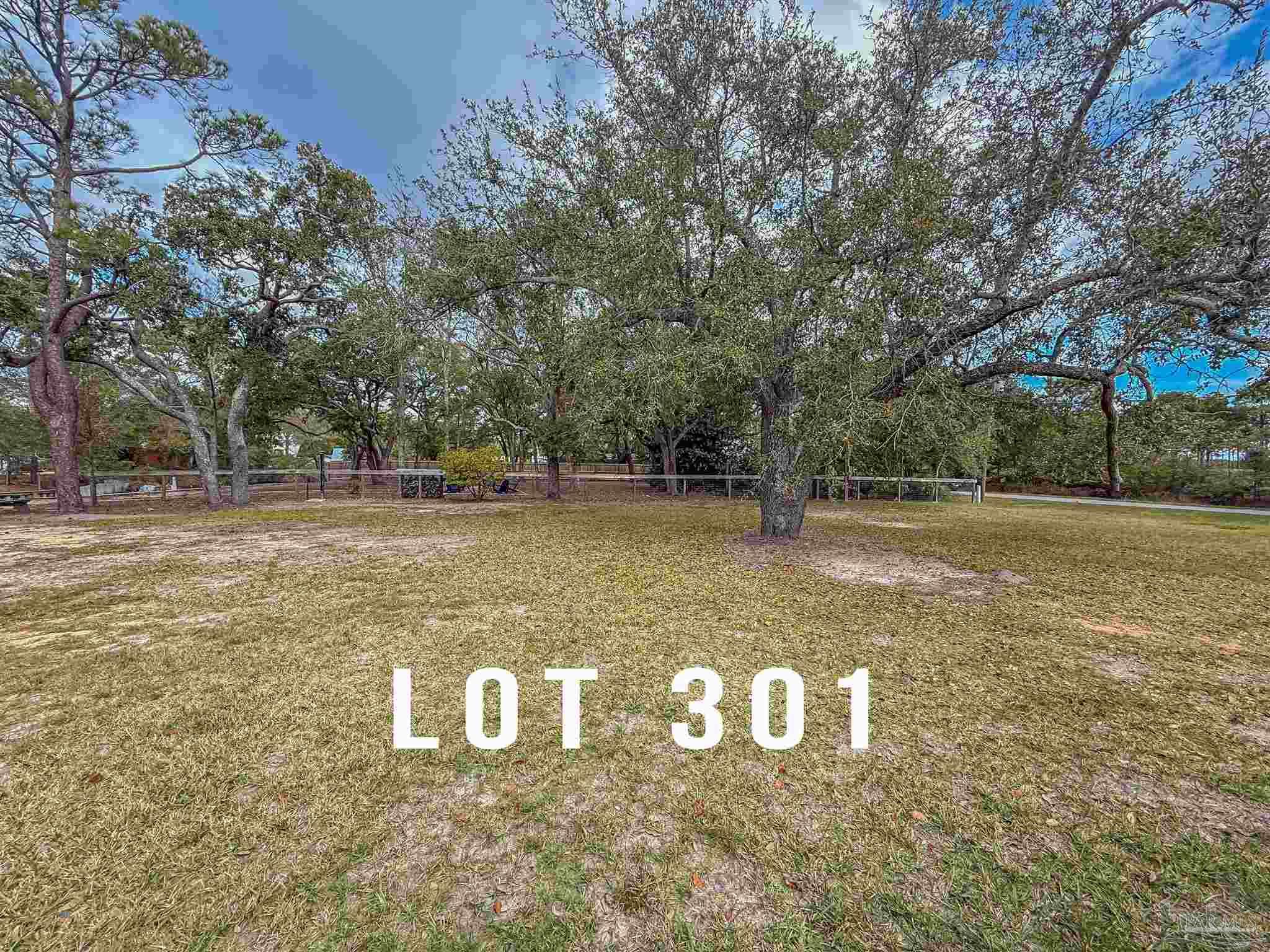 301 Katie Street Milton, FL 32583 - Photo 13 of 16 a view of a yard with large trees