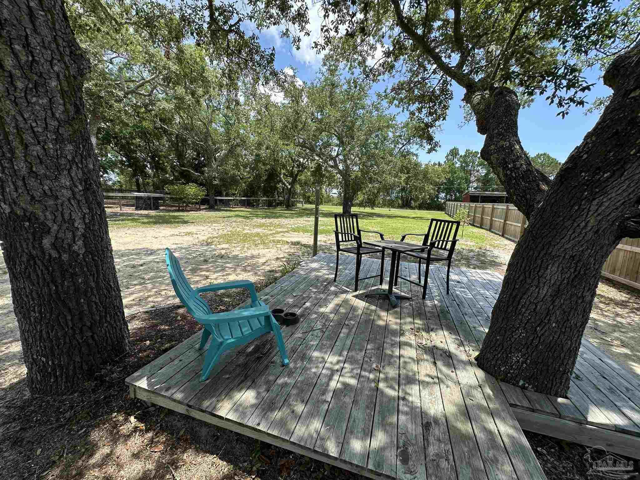 301 Katie Street Milton, FL 32583 - Photo 2 of 16 a view of a swimming pool with a patio