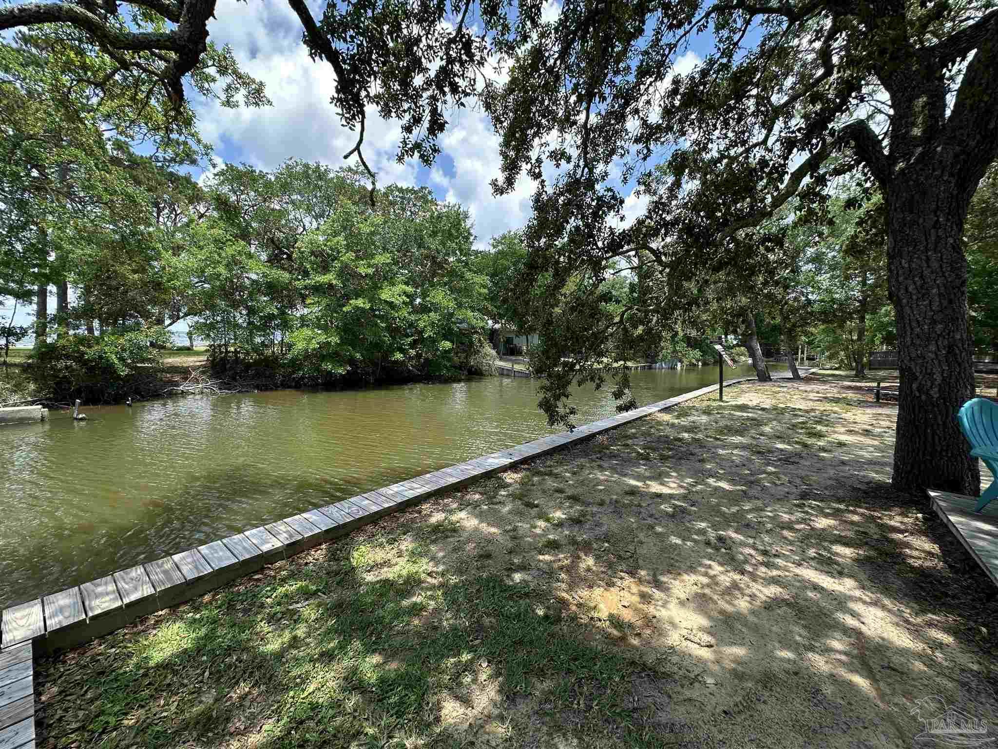 301 Katie Street Milton, FL 32583 - Photo 3 of 16 a view of lake with outdoor space