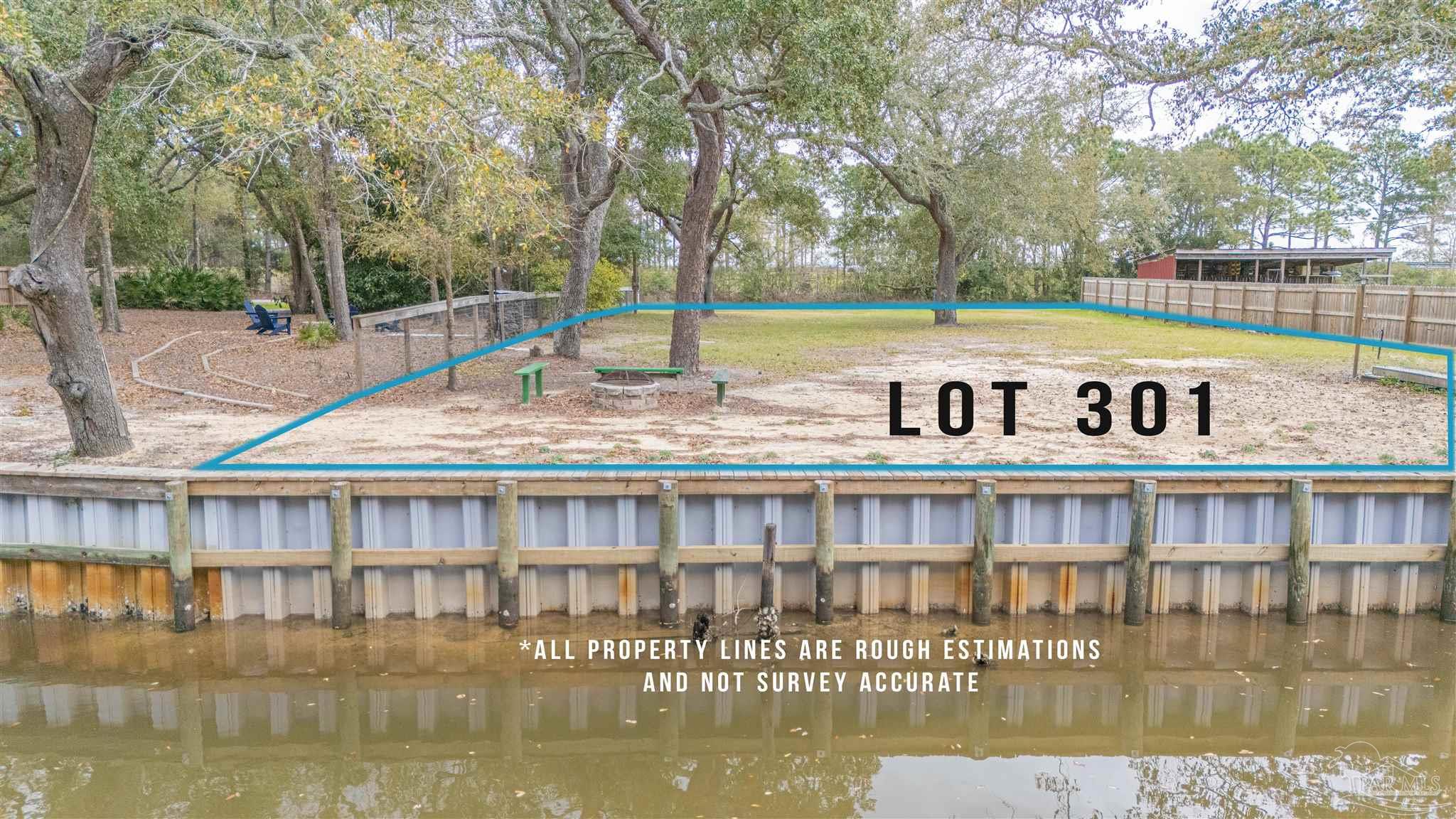 301 Katie Street Milton, FL 32583 - Photo 5 of 16 a view of a swimming pool with an outdoor space and seating area