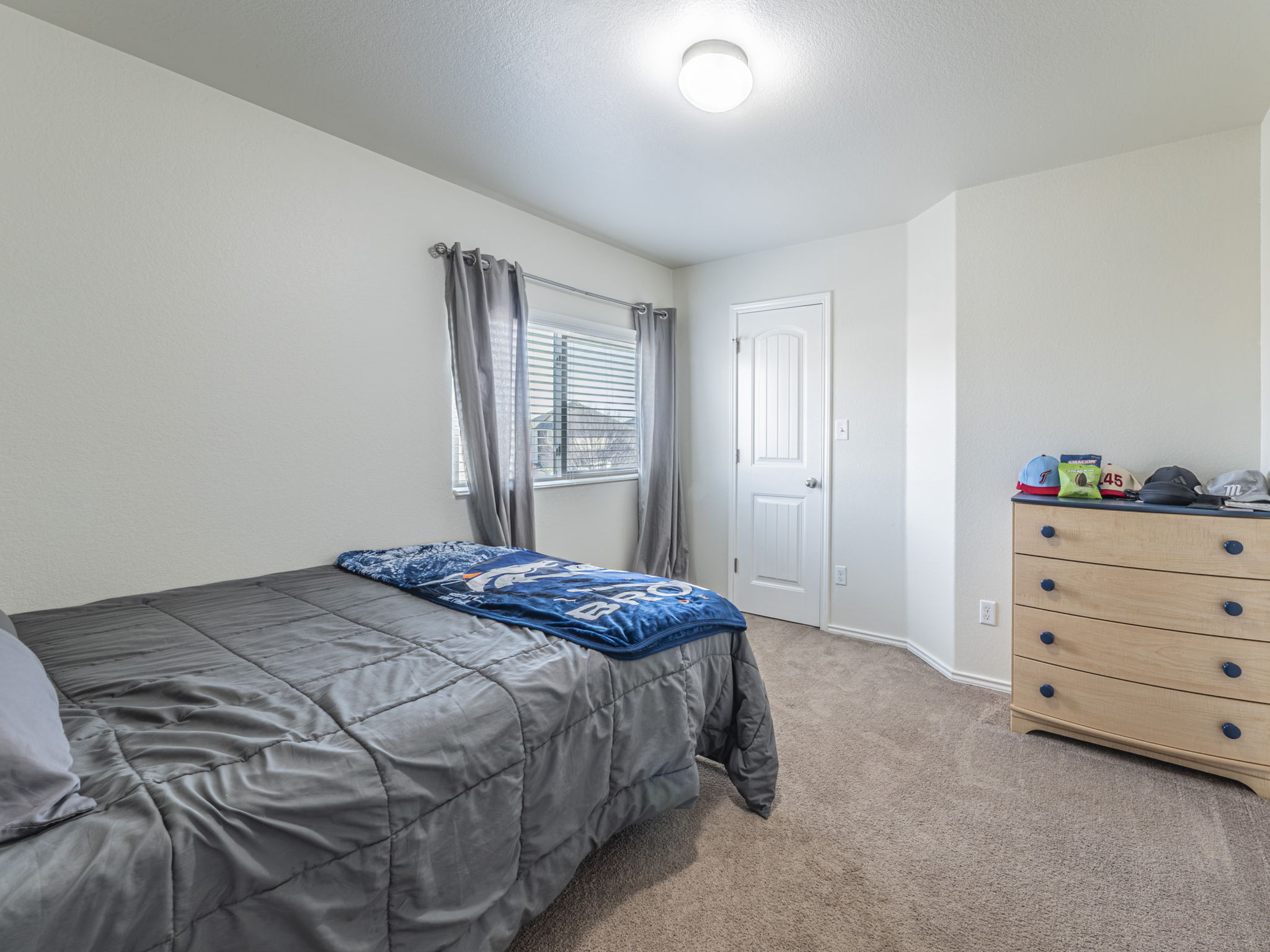 1366 Heep Run Buda, TX 78610 - Photo 20 of 37 Bedroom featuring light colored carpet and baseboards