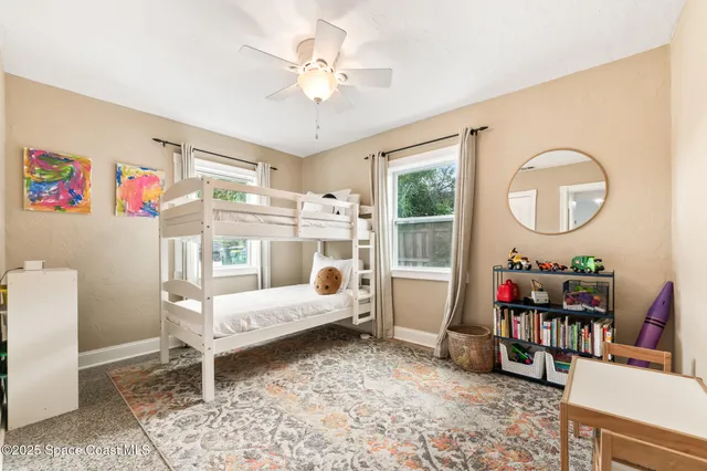a bathroom with a sink toilet vanity and tub