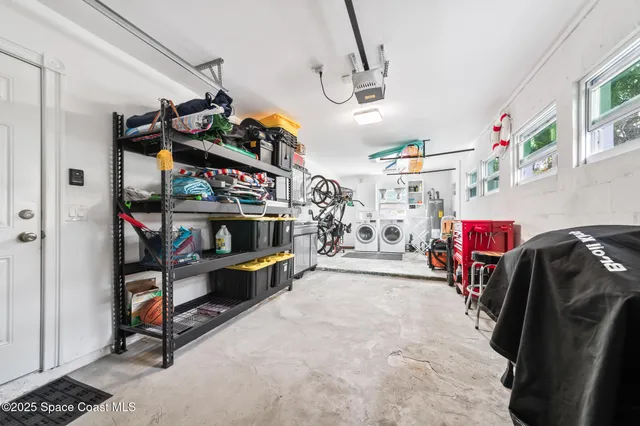 a view of a house with backyard sitting area and garden