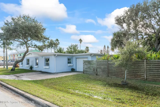 an aerial view of a house with a garden