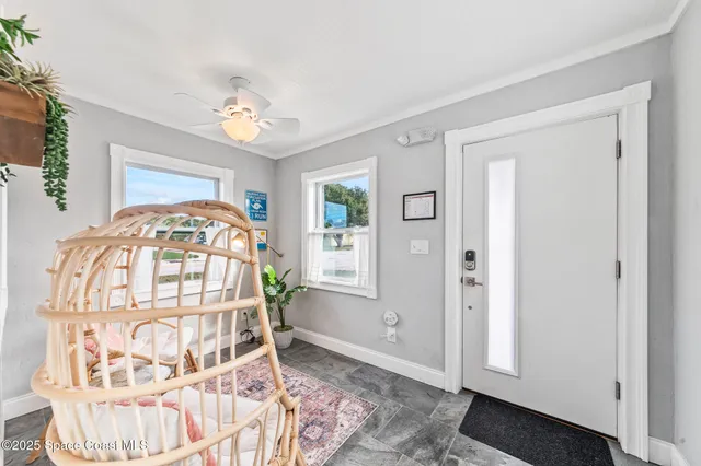 a living room with furniture and a christmas tree