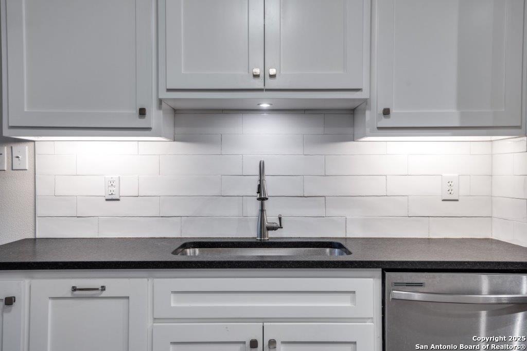 218 Ebner Street Boerne, TX 78006 - Photo 11 of 24 a sink with white cabinets