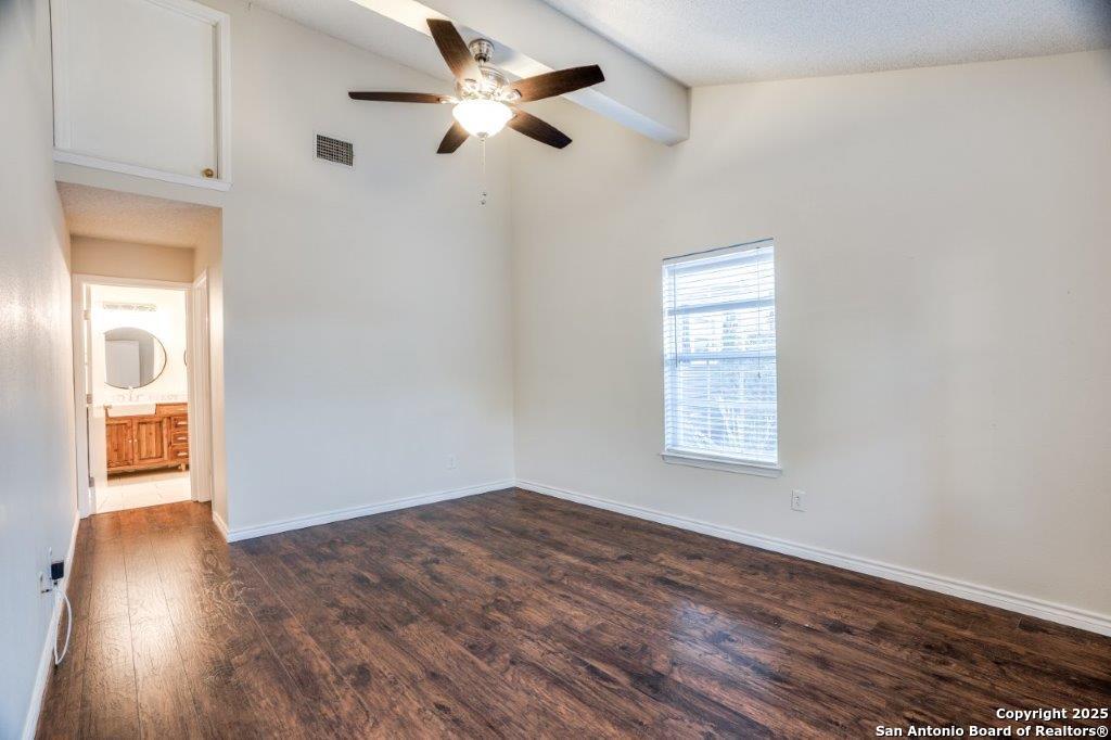 218 Ebner Street Boerne, TX 78006 - Photo 15 of 24 a view of an empty room with wooden floor and a window