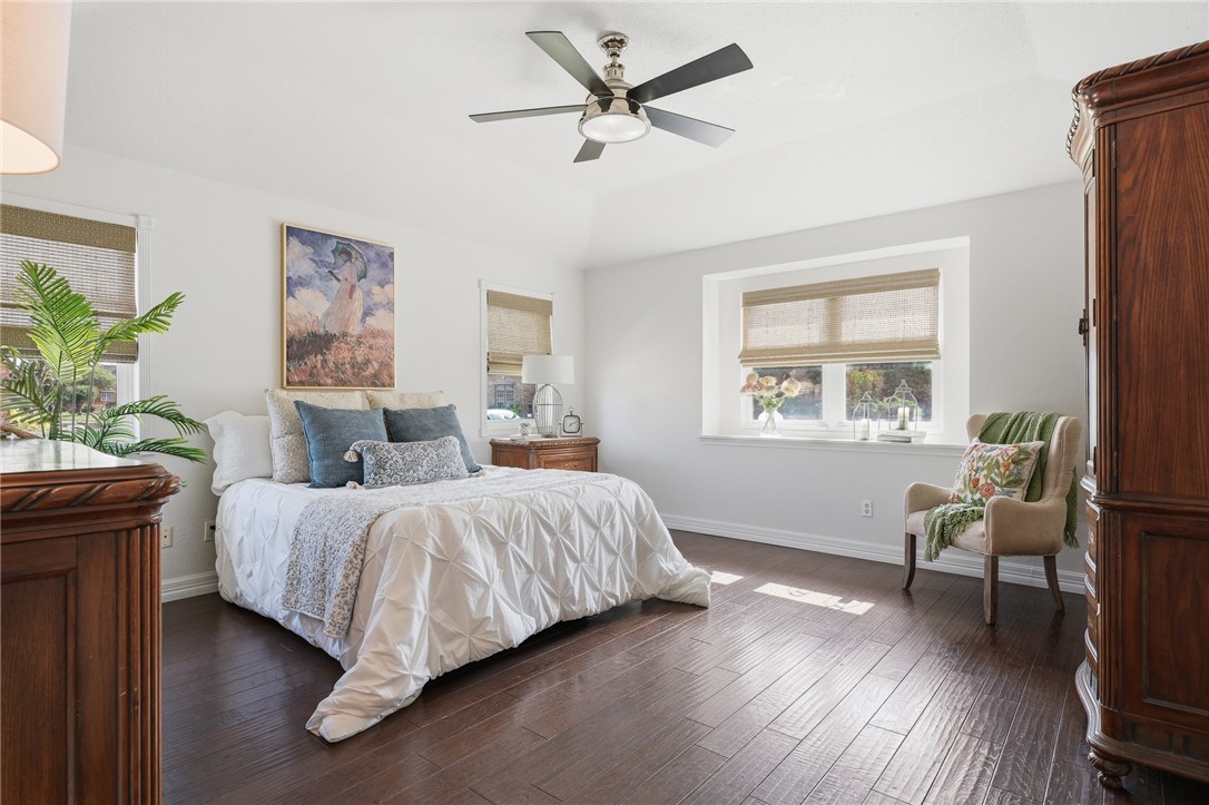 616 Colonial Drive Portland, TX 78374 - Photo 14 of 35 a bedroom with a bed wooden floor and a window